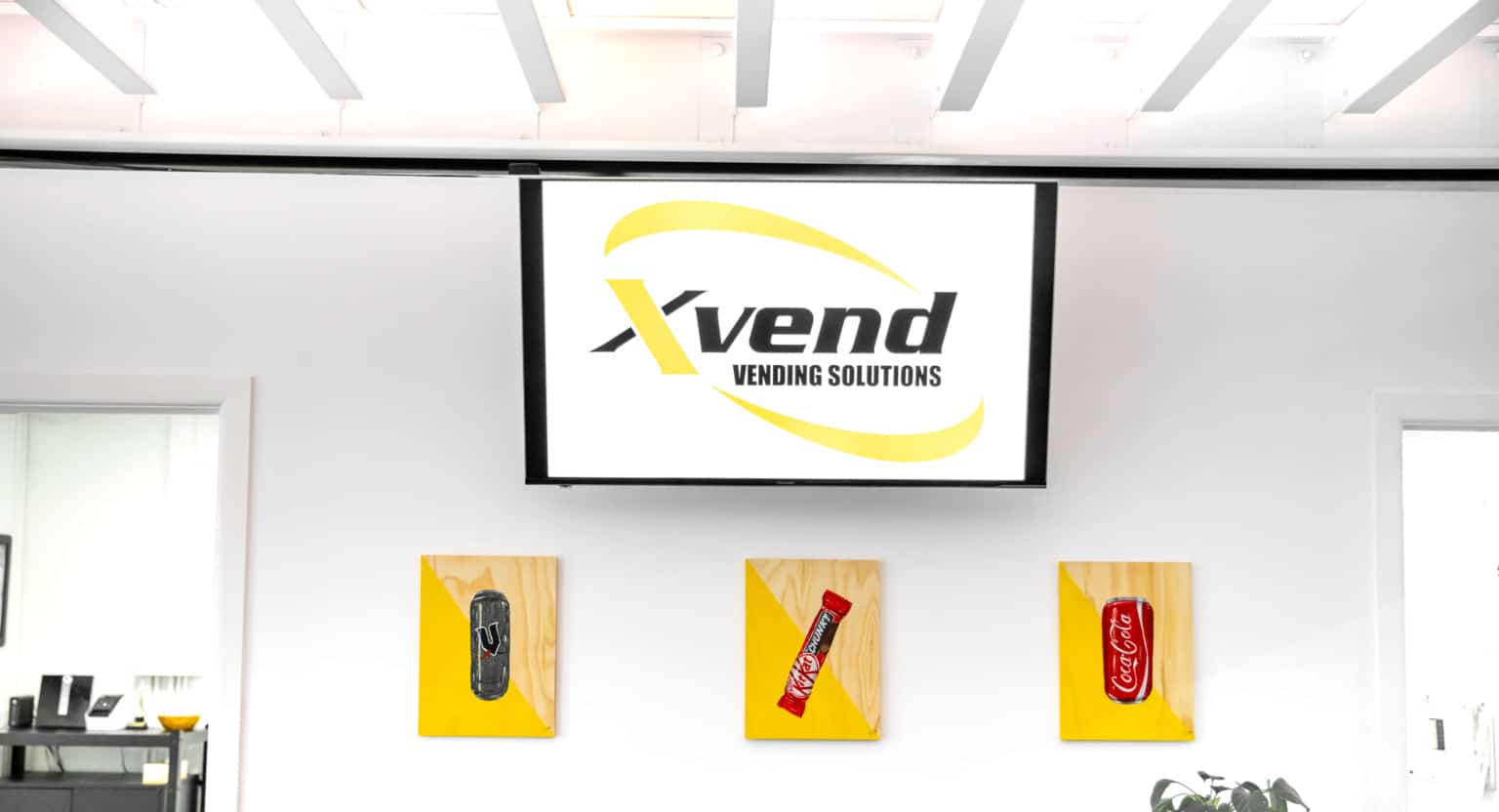 Xvend office with the Xvend logo on a display screen