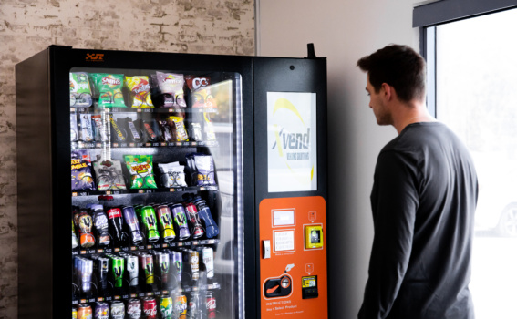 Customer Using An Xvend Fitness Vending Machine